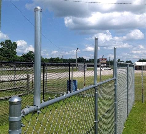 chain link fence height extension|chain link fence pole extenders.